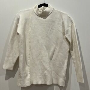 White ribbed turtleneck sweater